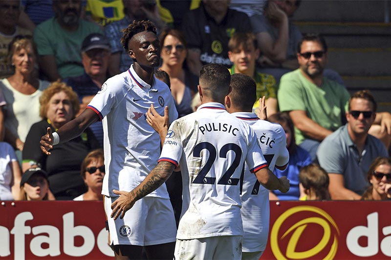 Chelsea's Tammy Abraham (left) celebrates scoring his side's third goal of the game with team-mates during the English Premier League football match between Norwich City and Chelsea at the Carrow Road Stadium, Norwich, England, on Saturday, August 24 2019. Photo: Joe Giddens/PA via AP