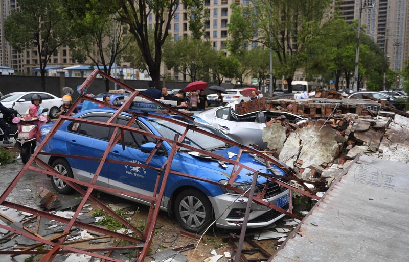 Cars are damaged after typhoon Lekima made landfall in Wenling, Zhejiang province, China August 10, 2019. Photo: Wang Gang/CNS via Reuters
