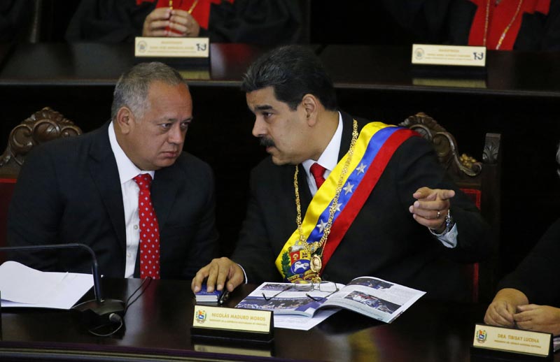 FILE - In this January 24, 2019 file photo, Venezuelan President Nicolas Maduro, right, speaks with Constitutional Assembly President Diosdado Cabello at the Supreme Court during an annual ceremony that marks the start of the judicial year in Caracas, Venezuela. Photo: AP