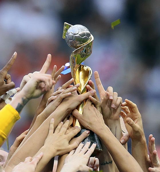 FILE - In this July 7, 2019, file photo, US players hold the trophy as they celebrate their victory in the Women's World Cup soccer final in Decines, outside Lyon, France. Photo: AP