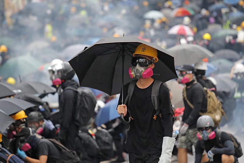 Protesters face police on a street during a pro-democracy protest, Hong Kong on August 31, 2019. Photo: AP