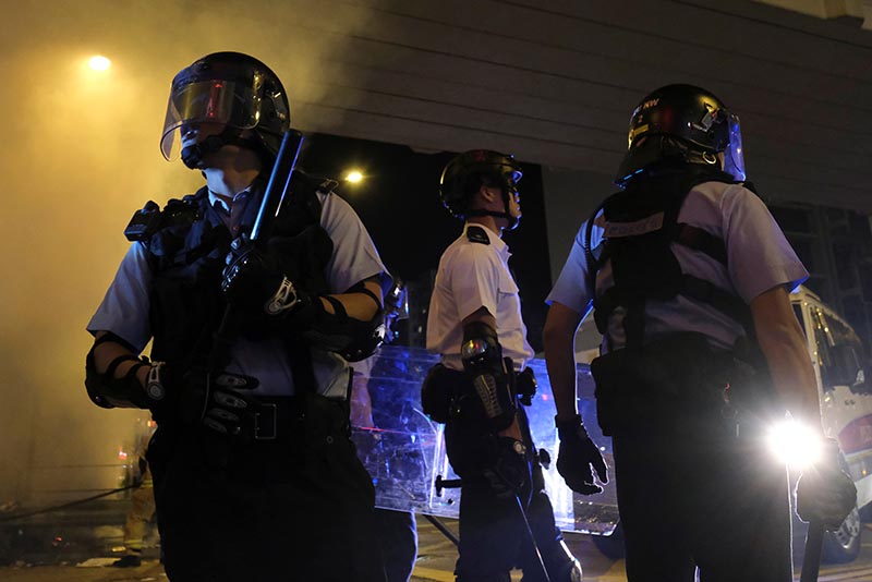 Riot police react as they disperse crowds of anti-government protesters during a rally outside Mong Kok police station, in Hong Kong, China, September 23, 2019. Photo: AP