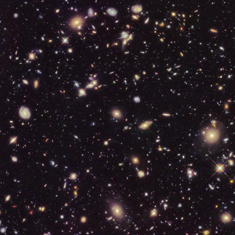 This image made available by the European Space agency shows galaxies in the Hubble Ultra Deep Field 2012, an improved version of the Hubble Ultra Deep Field image. Photo: NASA, ESA, R Ellis (Caltech), HUDF 2012 Team via AP