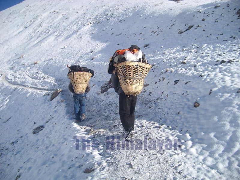 FILE - Porters walking en route to Thorang-La Pass from Manang in Annapurna Circuit. Photo: Rup Narayan Dhakal/THT