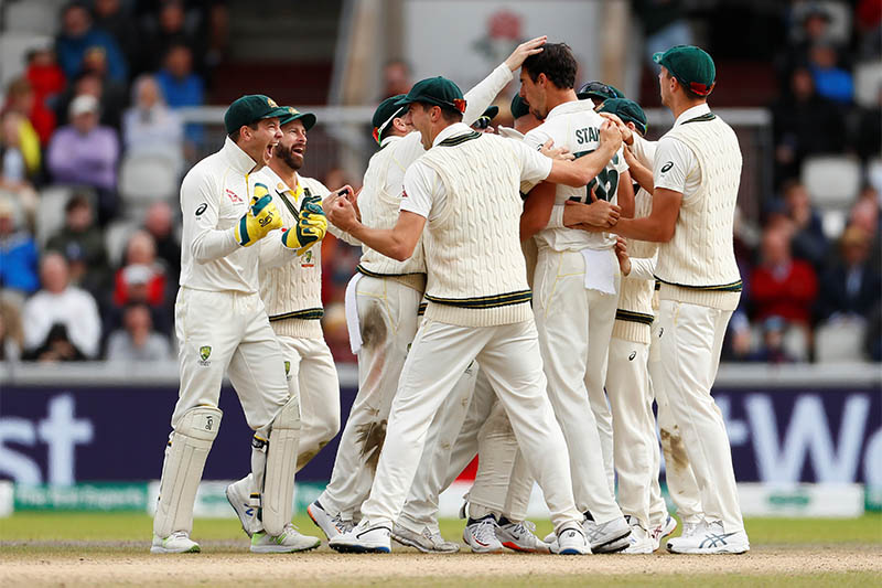 Australia's Mitchell Starc celebrates taking the wicket of England's Jonny Bairstow with team mates. Photo: Reuters