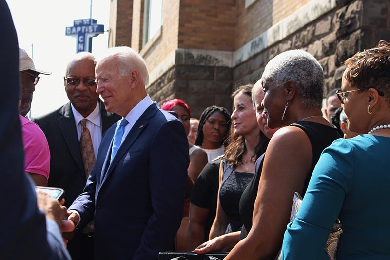 Former Vice President and presidential candidate Joe Biden, center, left, speaks with an attendee as he joins Sen. Doug Jones and Birmingham Mayor Randall Woodfin at a wreath laying after a service at 16th Street Baptist Church in Birmingham, Ala., Sunday on Sept.15, 2019. Photo: AP