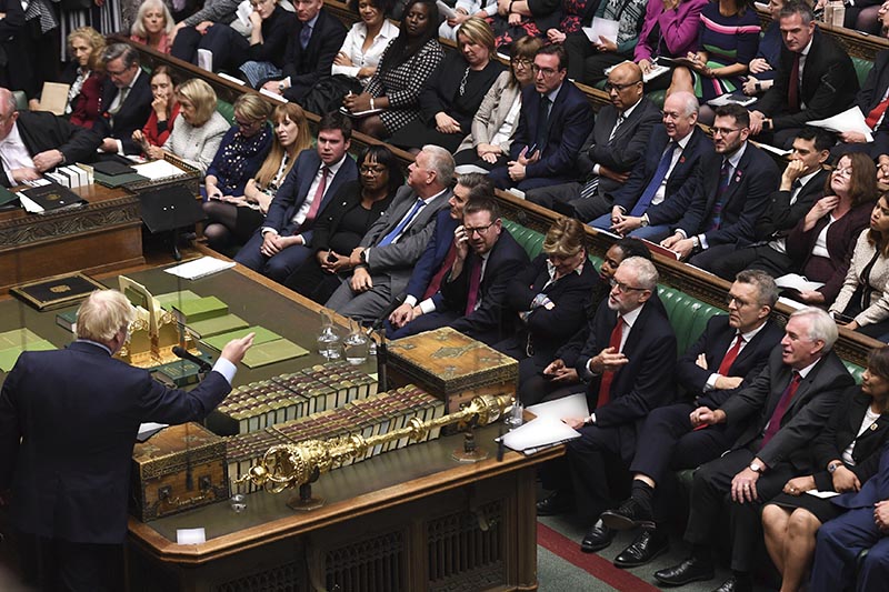 In this handout photo provided by the House of Commons, Britain's Prime Minister Boris Johnson, left, speaks in Parliament in London, Wednesday, Sept. 25, 2019. Photo: AP