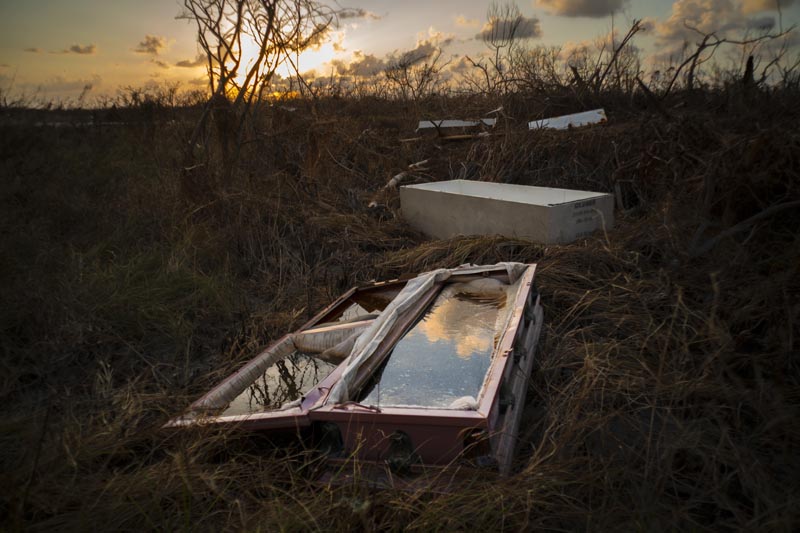 A shattered and water-filled coffin lays exposed to the elements in the aftermath of Hurricane Dorian, at the cemetery in Mclean's Town, Grand Bahama, Bahamas, Wednesday Septenber 11, 2019. Photo: AP