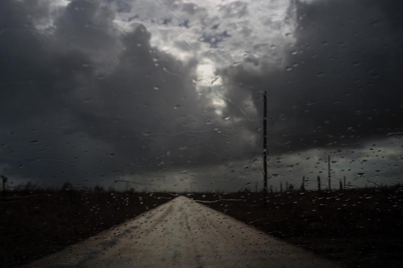 Rain drops cover a car's window shield prior to the arrival of a new tropical depression, that turned into Tropical Storm Humberto, in the aftermath of Hurricane Dorian en route to Mclean's Town, Grand Bahama, Bahamas, Friday Sept. 13, 2019. Humberto narrowly missed the island over the weekend. Photo: AP