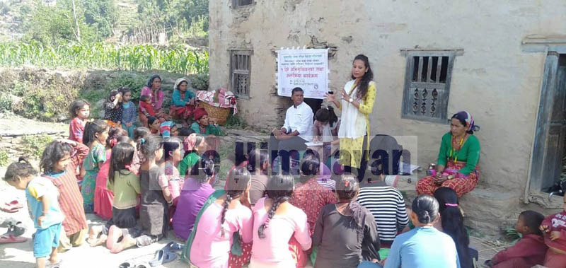 A health worker informing the locals about family planning methods in Bajura district. Photo: Prakash Singh/THT