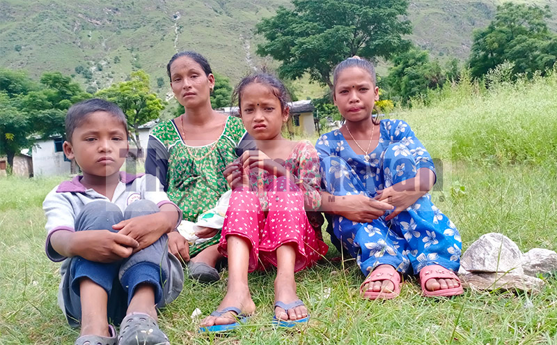 Pictured here are a pregnant woman and her three children who are struggling to make their ends meet, in Kotila, Budhinanda Municipality-6, of Bajura district. Photo: Prakash Singh/THT