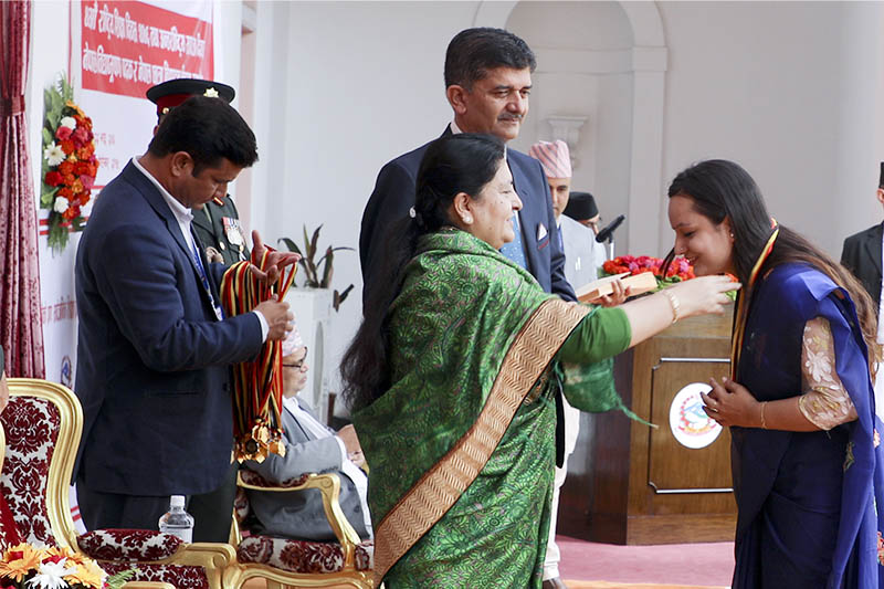 nnPresident Bidya Devi Bhandari confers the 'Nepal Bidya Bhushan' (B) on Sonyca Lamichhane on the occasion of the 40th National Education Day, at the President's Office, in Maharajgunj, on Sunday, September 08, 2019. Courtesy: President's Office