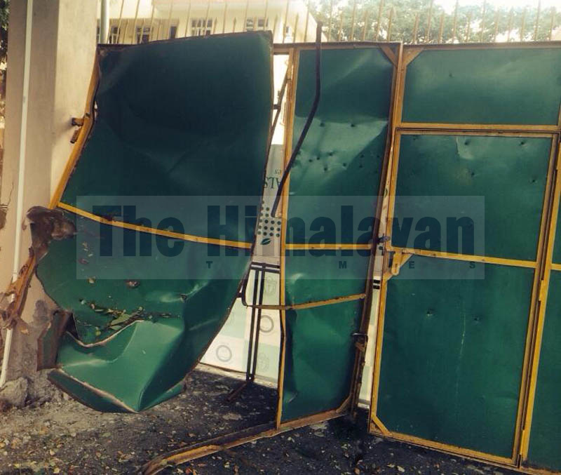An iron gate damaged because of the bomb blast that took place at 12:30 am in the premises of Dharan Public School of Sunsari district. Photo: Santosh Kafle/ THT Online
