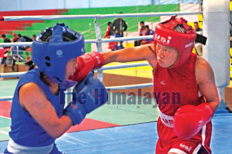 Mala Rai (right) of Nepal APF Club fights against Roshani Rai of Province-3 during therir 51 kg final bout in the selection tournamentin at Nepali Army Sports Complex in Lalitpur on Monday, September 16, 2019. Photo: Udipt Singh Chhetry/THT