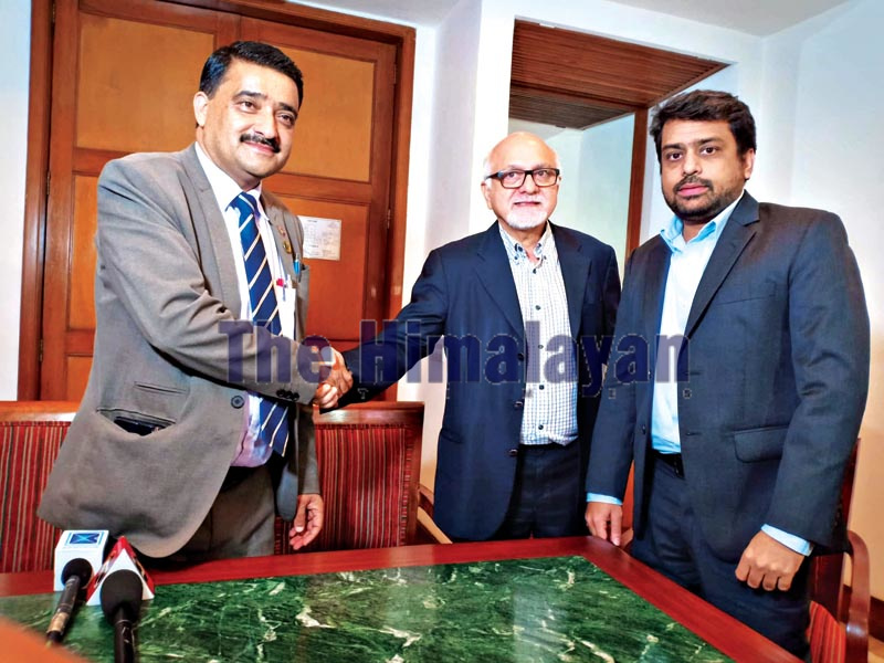 National Sports Council Member Secretary Ramesh Kumar Silwal (left) shakes hands with International Cricket Council Deputy Chairperson Imran Khawaja as ICC Finance Manager Amar Sheikh looks on, after a meeting regarding the elective general assembly of Cricket Association of Nepal, in Kathmandu on Monday, September 16, 2019. Photo: THT