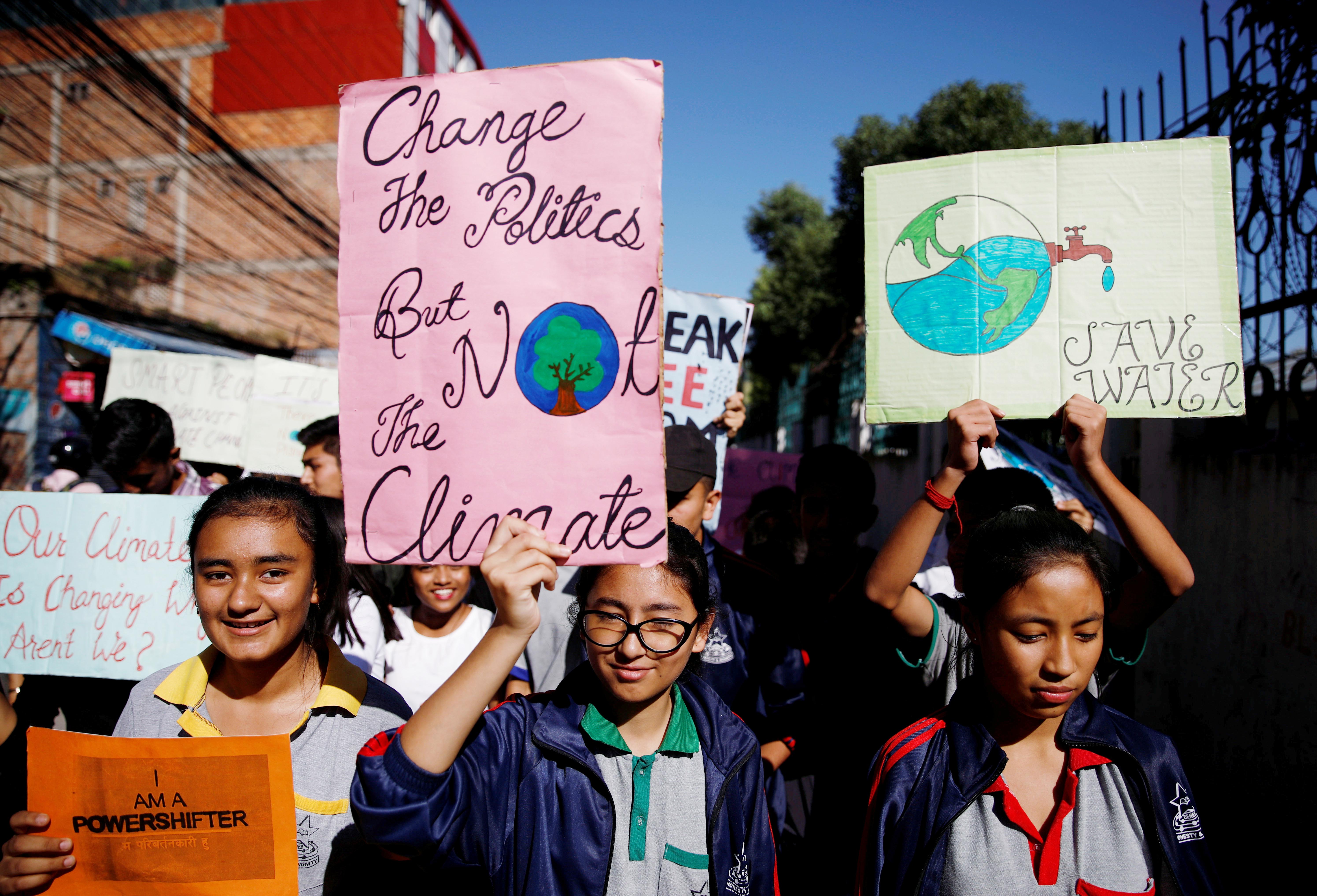 Students holding placards take part in the Global Climate Strike in Kathmandu, Nepal September 20, 2019. REUTERS/Navesh Chitrakar