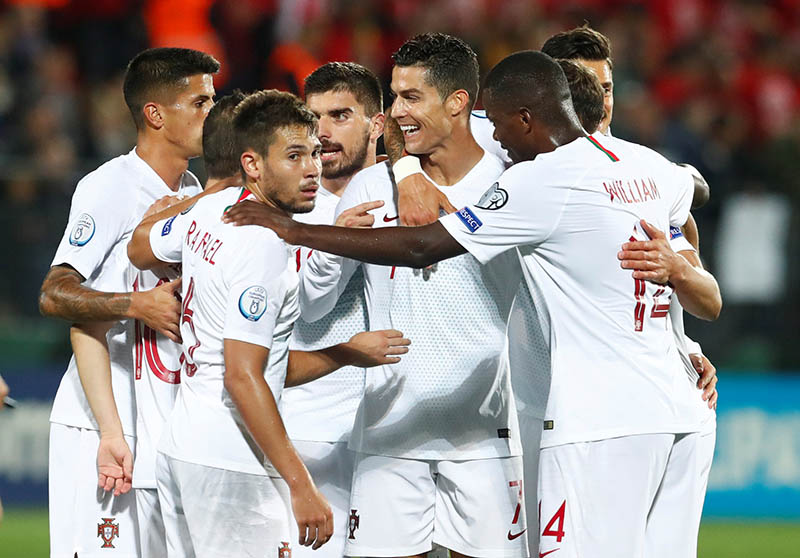 Portugal's Cristiano Ronaldo celebrates scoring their second goal with team mates during the Euro 2020 Qualifier  Group B match between Lithuania and Portugal, at LFF Stadium, in Vilnius, Lithuania, on September 10, 2019. Photo: Reuters
