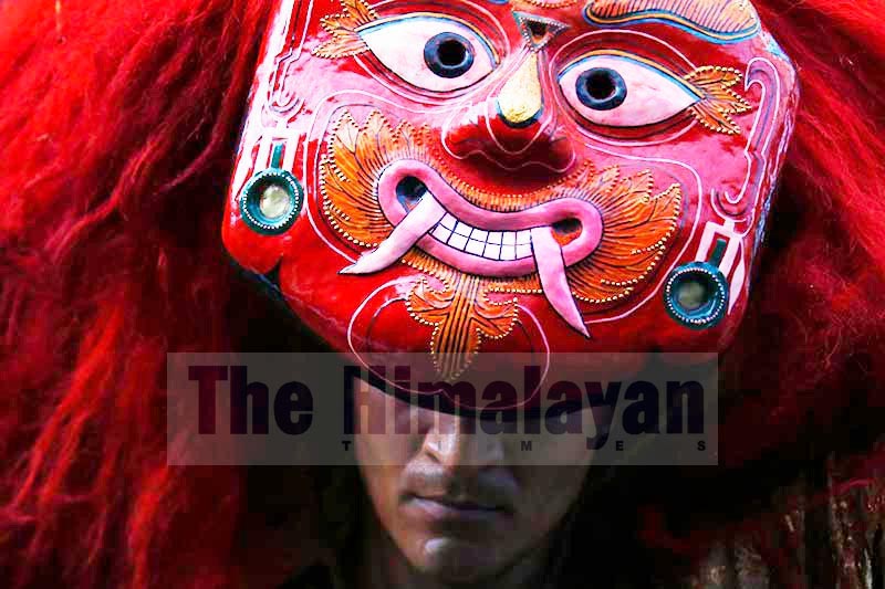 A masked dancer performing Lakhey dance during a chariot procession of the Kumari, revered as a living 
goddess, on the main day of Indra Jatra at Basantapur Durbar Square, in Kathmandu, on Friday, September 13, 2019. Photo: Skanda Gautam/THT