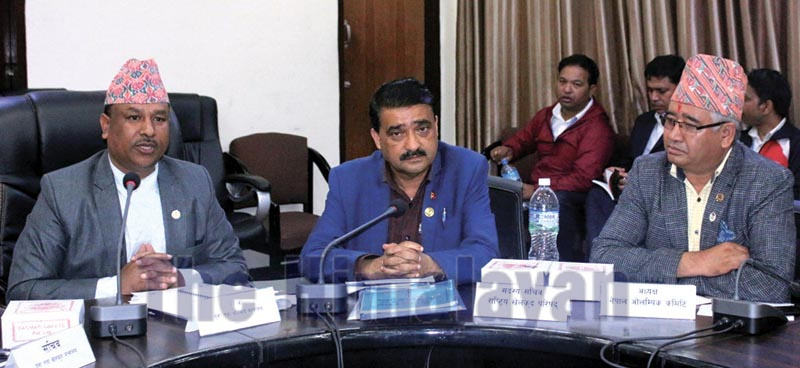 Youth and Sports Minister Jagat Bahadur Sunar (left) speaks as NSC Member Secretary Ramesh Kumar Silwal and NOC President Jeevan Ram Shrestha (right) look on during the meeting of 13th SAG Organising Committee in Kathmandu on Thursday, September 26, 2019.Photo: THT