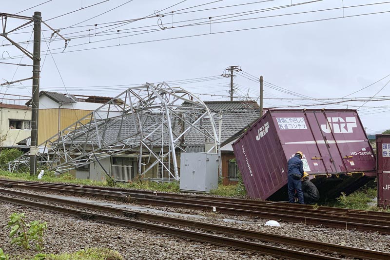 A cargo container and a steel tower are damaged by winds after Typhoon Tapah hit Nobeoka, Miyazaki prefecture, southwestern Japan Sunday, Sept 22, 2019. Photo: Kyodo News via AP