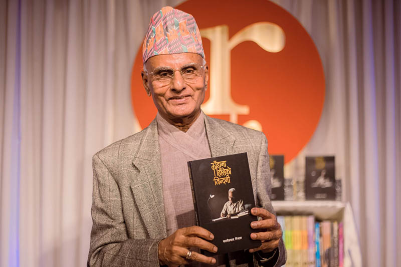 Writer Kali Prasad Rijal poses for a portrait with his book 'Kada ma Haseko Jindagi' in Kathmandu, on Saturday, September 28, 2019. Courtesy: Nepalaya