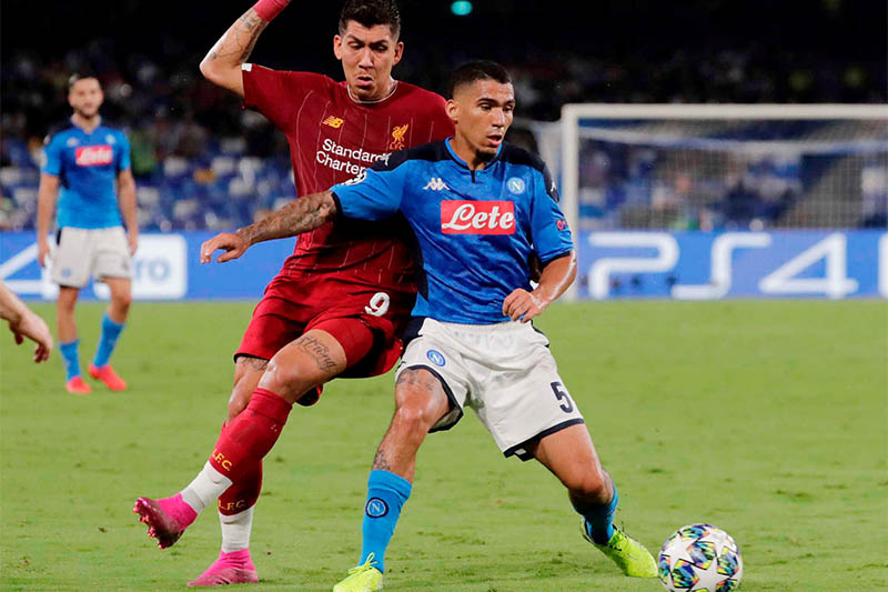 Liverpool's Roberto Firmino in action with Napoli's Allan. Photo: Reuters