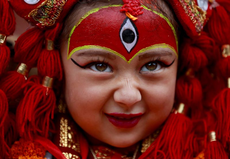 A young girl dressed as the Living Goddess Kumari participates in the Kumari Puja festival, in which young girls pose as the Living Goddess Kumari and are worshipped by people in the belief that their children will remain healthy, in Kathmandu, Nepal, on September 11, 2019. Photo: Reuters