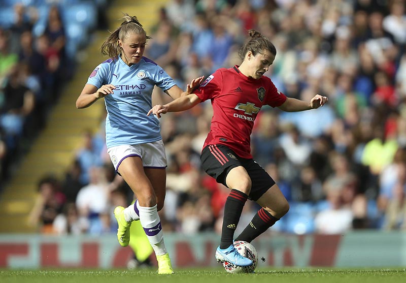 Manchester City's Georgia Stanway (left), and Manchester United's Hayley Ladd battle for the ball during the Women's Super League soccer match at the Etihad Stadium, Manchester, England, Saturday Sept. 7, 2019. Photo: Nigel French/PA via AP