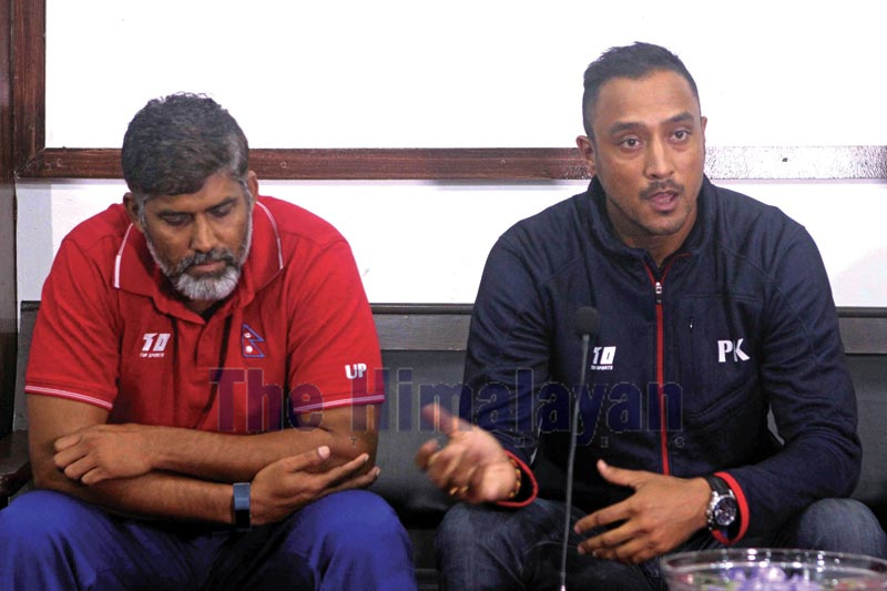 Paras Khadka (right) skipper of national cricket team reacts with media while coach Umesh Patwal looks on during press meet of the announcement of team for tri-series cricket matches with Singapore and Oman in Kathmandu on Thursday, September 19, 2019. Photo: Udipt Singh Chhetry/THT