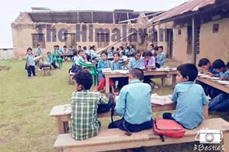 Students attending class in open on the premises of Mahendra Basic School in Udayapur district, on Wednesday, September 18, 2019. Photo: Shyam Rai/THT
