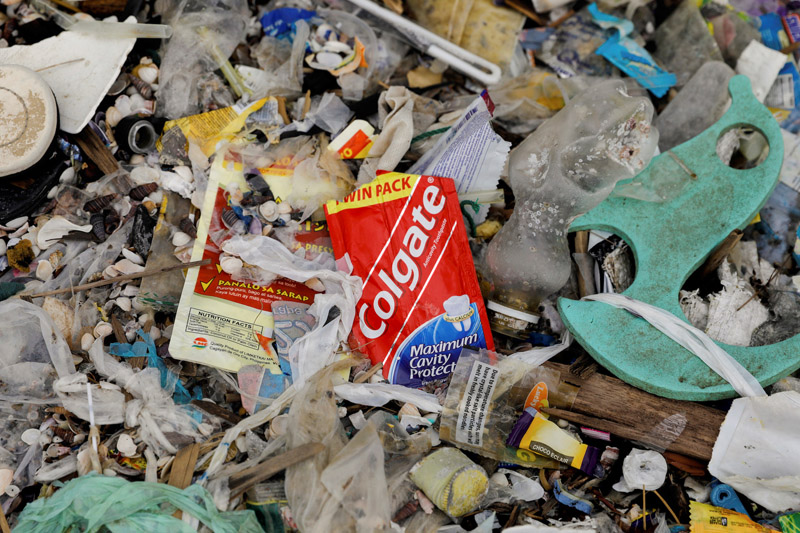 A sachet of Colgate toothpaste is pictured amidst a garbage-filled shore on Freedom Island, Paranaque City, Metro Manila, Philippines, July 15, 2019. Photo: Reuters
