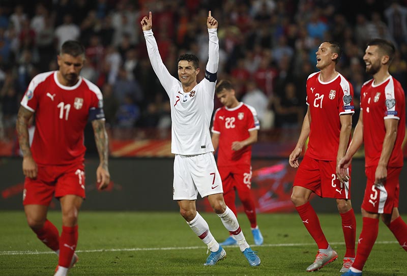 Portugal's Cristiano Ronaldo celebrates after Portugal's Bernardo Silva scored his side's fourth goal during the Euro 2020 group B qualifying soccer match between Serbia and Portugal, on the stadium Rajko Mitic in Belgrade, Serbia, Saturday, Sept. 7, 2019. Photo: AP