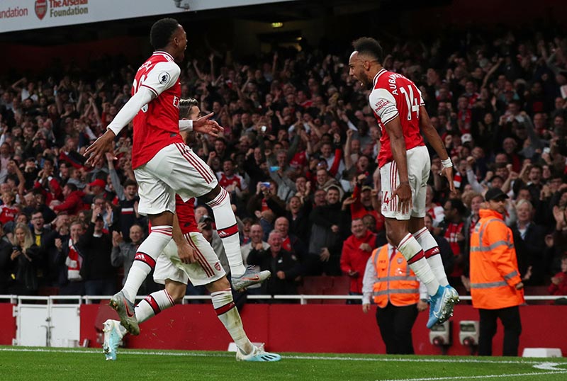 Arsenal's Pierre-Emerick Aubameyang celebrates scoring their third goal with teammates during the Premier League match between Arsenal and Aston Villa, at Emirates Stadium, in London, Britain, on September 22, 2019. Photo: Reuters
