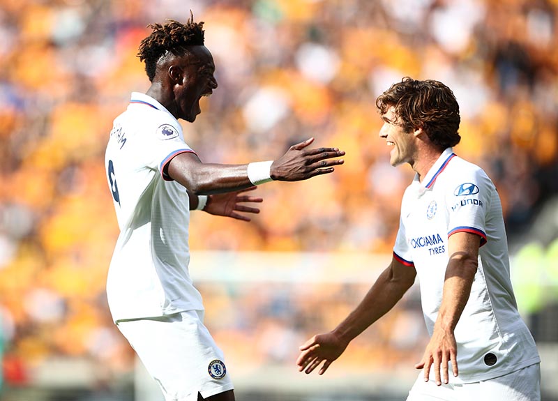 Chelsea's Tammy Abraham celebrates scoring their second goal with Marcos Alonso  during the Premier League match between Wolverhampton Wanderers and Chelsea, at Molineux Stadium, in Wolverhampton, Britain, on September 14, 2019. Photo: Reuters