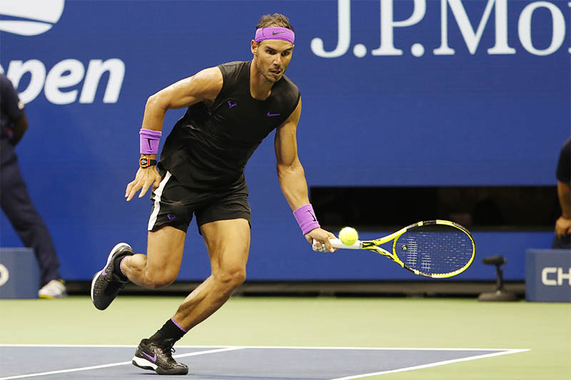 Rafael Nadal of Spain chases a shot to hit a forehand around the net post against Marin Cilic of Croatia (not pictured) in the fourth round on day eight of the 2019 US Open tennis tournament at USTA Billie Jean King National Tennis Center. Mandatory Credit: Geoff Burke-USA TODAY Sports