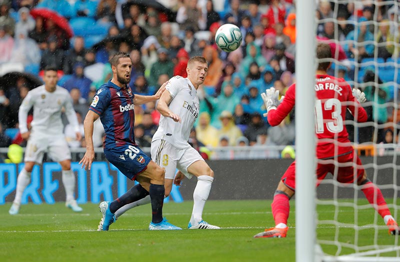 Real Madrid's Toni Kroos in action with Levante's Jorge Miramon during the La Liga Santander match between Real Madrid and Levante, at Santiago Bernabeu, in Madrid, Spain, on September 14, 2019. Photo: Reuters
