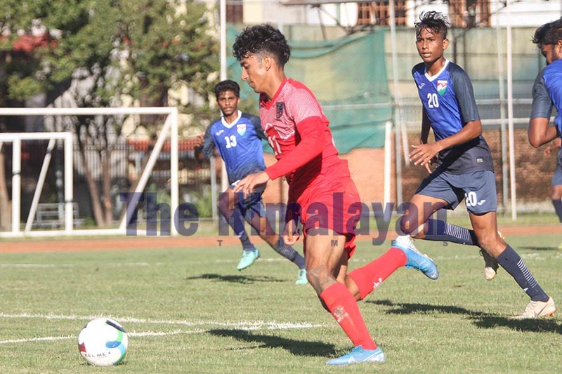 Nepalu2019s Manish Dangi (left) dribbles the ball past Maldives players during their SAFF U-18 Championship match at the Nepal APF Club grounds in Kathmandu on Friday, September 20, 2019. Photo: Udipt Singh Chhetry/THT