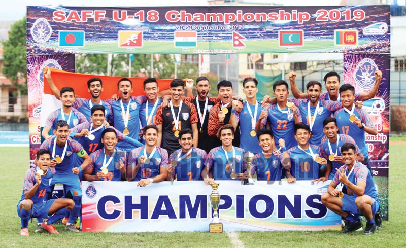 India team members celebrate with the trophy after winning the SAFF U-18 Championship at the Nepal APF Club grounds in Kathmandu on Sunday, September 29, 2019. Photo: Udipt Singh Chhetry / THT