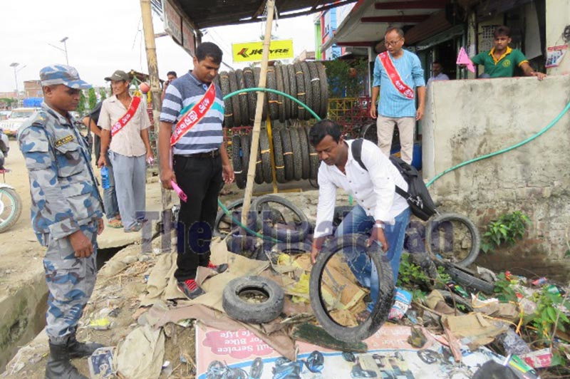 Local representatives inspecting a garage as part of the dengue control campaign, in Siraha, on Saturday. Photo: THT