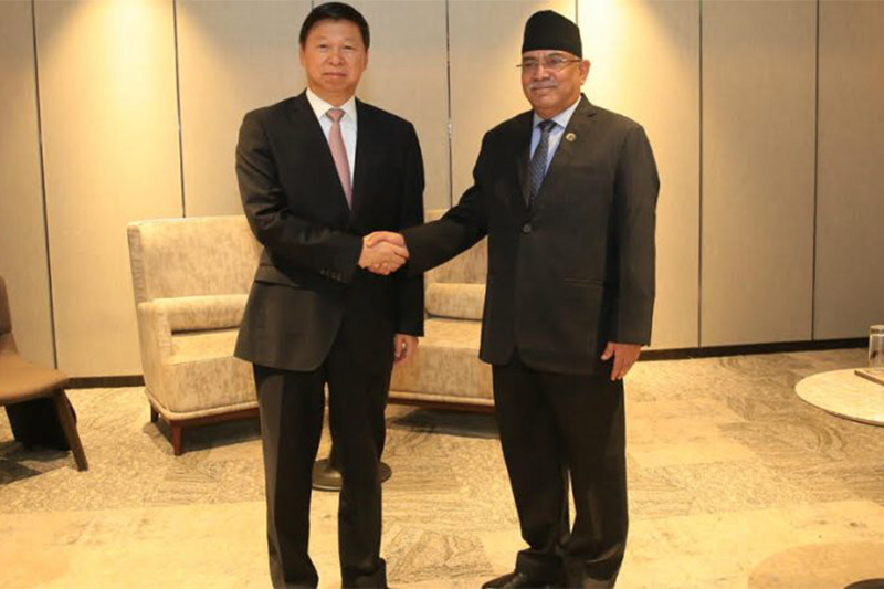 Communist Party of Chinau2019s International Liaison Departmentu2019s Director Song Tao (left) shakes hands with Nepal Communist Party (NCP) Co-chairperson Pushpa Kamal Dahal, in Kathmandu, on Tuesday. Photo courtesy: CMPrachanda