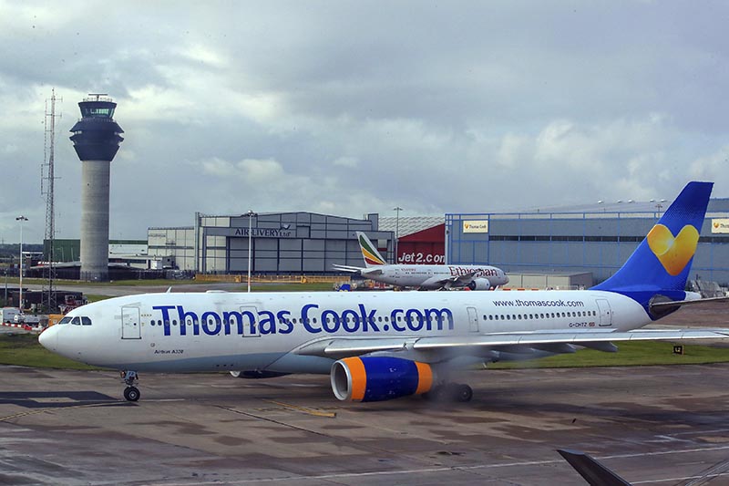A Thomas Cook plane taxis on the runway at terminal one of Manchester Airport, England. More than 600,000 vacationers who booked through tour operator Thomas Cook were on edge Sunday, wondering if they will be able to get home, as one of the world's oldest and biggest travel companies teetered on the edge of collapse. Photo: AP