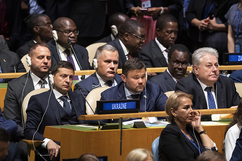 Delegates from Ukraine including President Volodymyr Zelensky, left, and Ambassador to UN Volodymyr Yelchenko, right, listen as US President Donald Trump addresses the 74th session of the United Nations General Assembly at U.N. headquarters Tuesday, Sept. 24, 2019. Photo: AP
