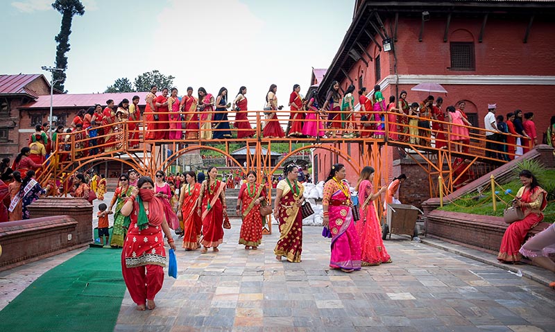 Women on queue for their turn to worship to the Lord Shiva as they celebrate the Teej festival at the premises of Pashupatinath in Kathmandu on Monday. Photo: Naresh Shrestha/ THT
