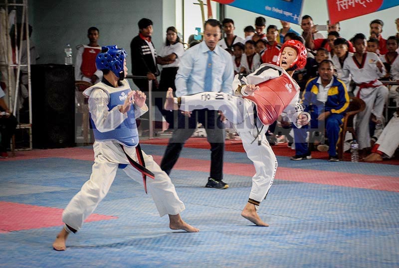 Players in action during the third Tensberg Kathmandu International Taekwondo Championship in Lalitpur on Friday, September 13, 2019. Photo: Naresh Shrestha/THT