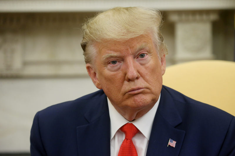 US President Donald Trump answers questions from the news media in the Oval Office of the White House in Washington, US, September 11, 2019. Photo: Reuters