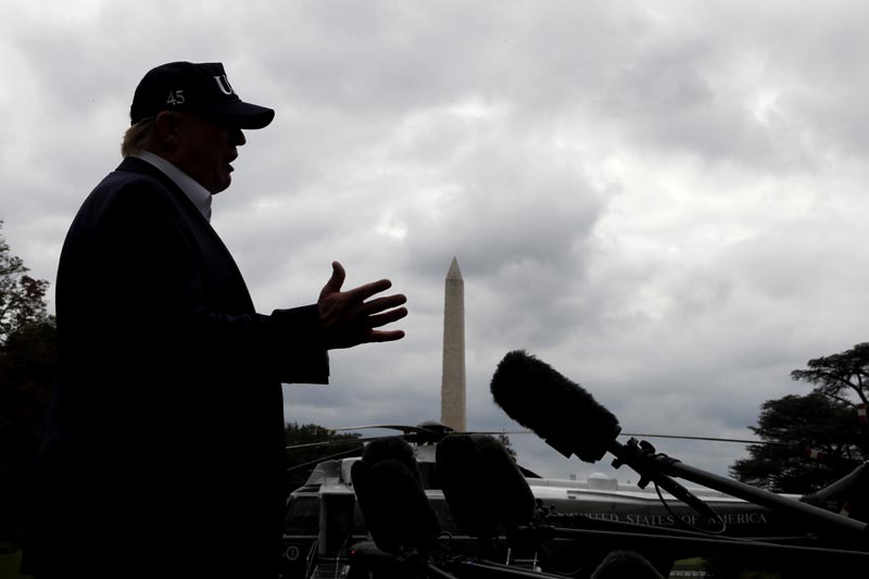 With cloudy skies in Washington, President Donald Trump speaks to the media as he returns to the White House from Camp David, Sunday, September 1, 2019, in Washington. Photo: AP