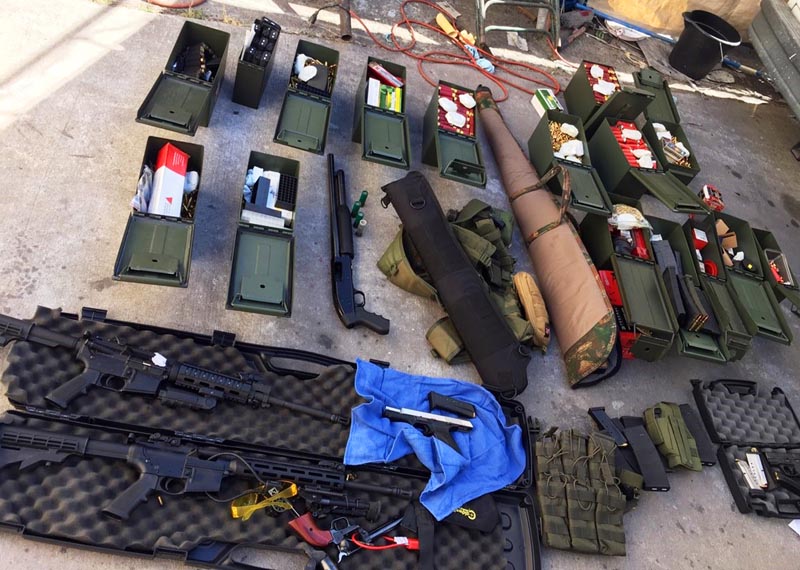 FILE - This undated file photo released by the Long Beach, California, Police Department shows weapons and ammunition seized from a cook at a Los Angeles-area hotel who allegedly threatened a mass shooting. Photo: Long Beach Police Department via AP