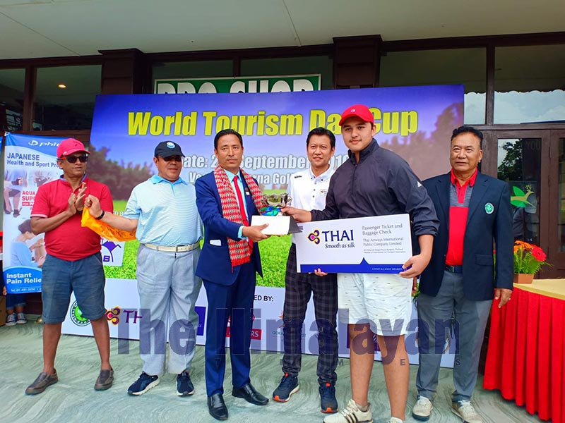 Prince Bhandari (right) receiving the trophy after the World Tourism Day Cup Golf Tournament in Kathmandu on Friday, September 27, 2019. Photo: THT