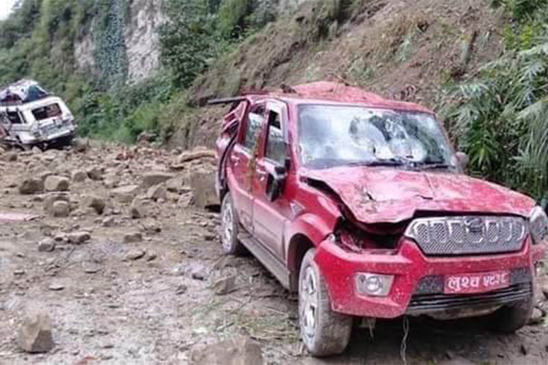 A vehicle is seen damaged after being hit by falling rocks. Courtesy: Milan Thapa Magar/Facebook