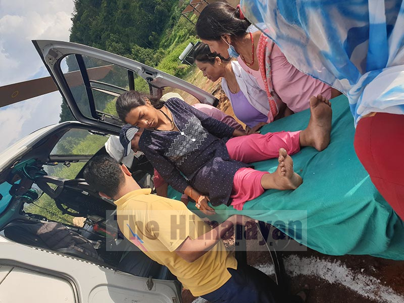 Indra BK being airlifted to Nepalgunj Medical College in Banke from Achham district for treatment. Photo: Prakash Singh/THT